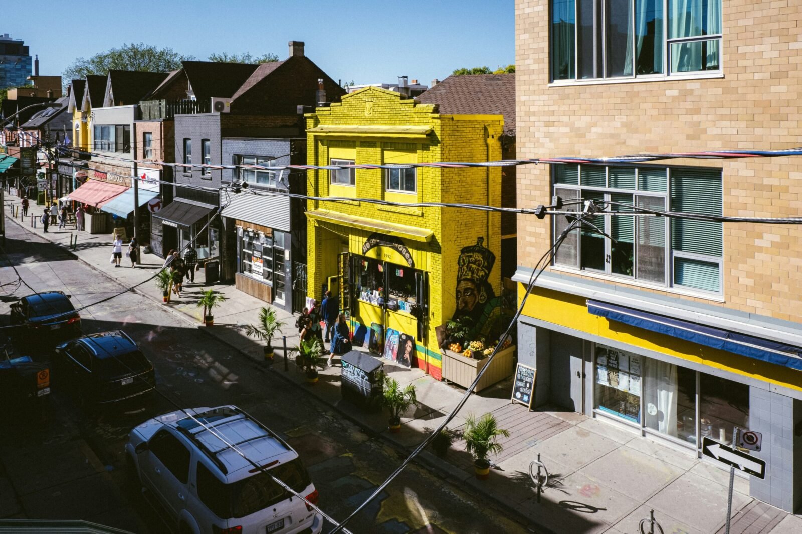 Street scene in Kensington Market Toronto with shops and cafés