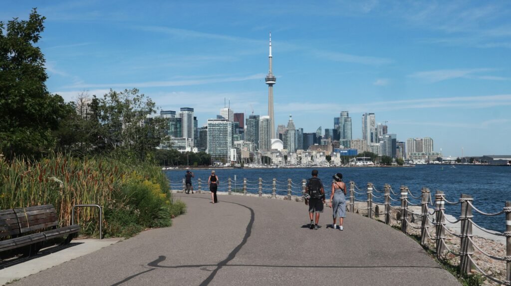 Toronto Harbourfront waterfront walkway with CN Tower skyline.