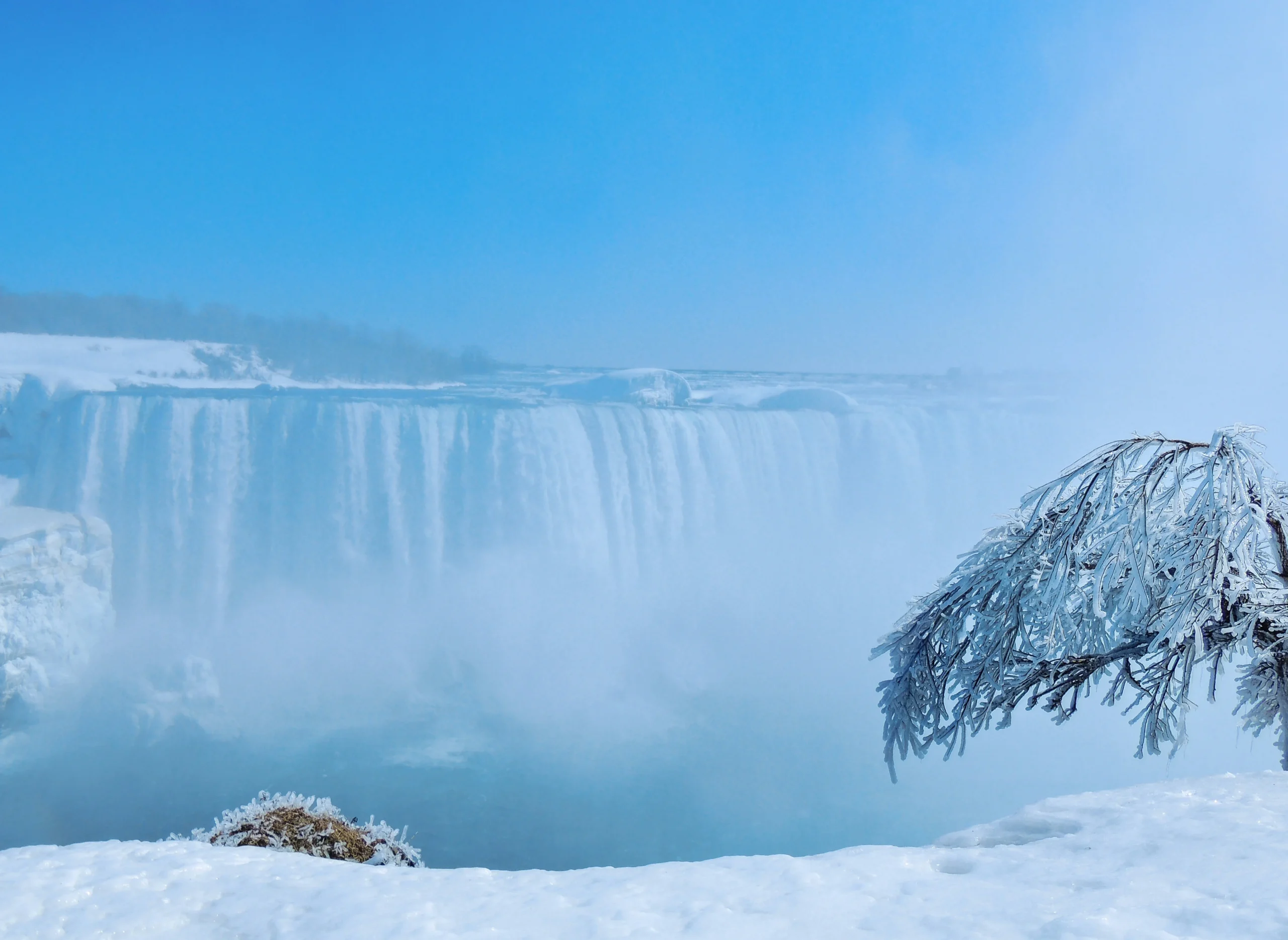Horseshoe Falls partially frozen in winter in Niagara Falls Ontario