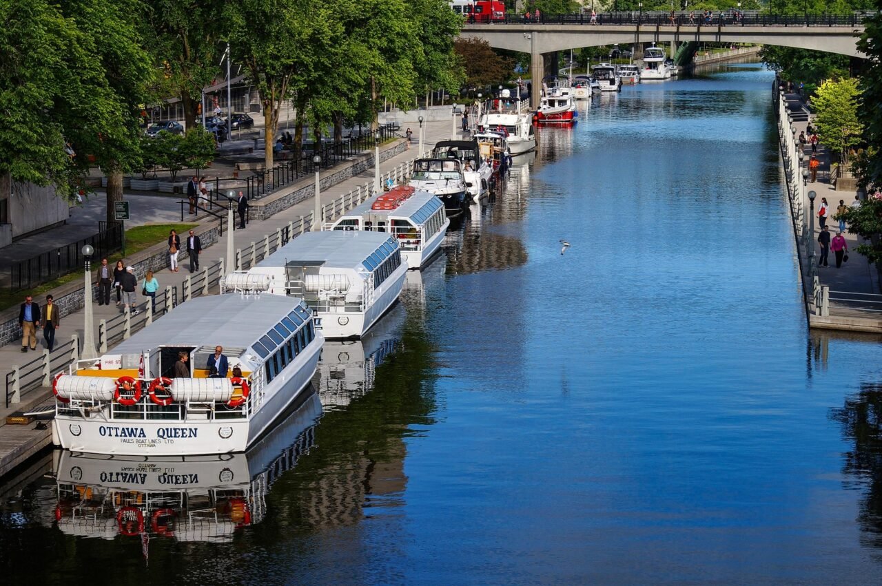 Boats on the Rideau Canal in Ottawa near downtown walkways