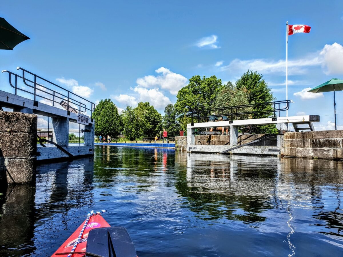 Kayaker passing through Rideau Canal lock in Merrickville Ontario