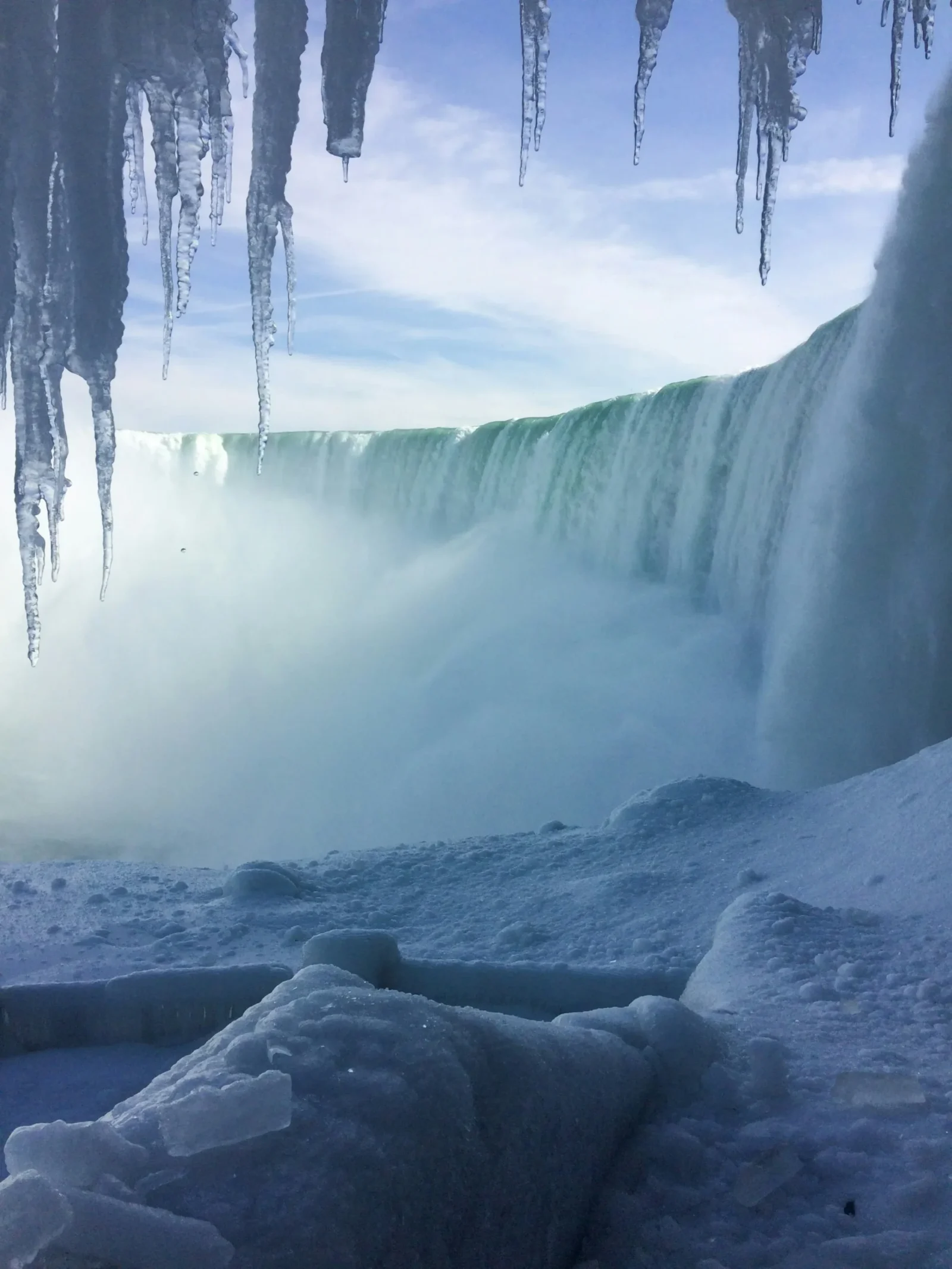 Icicles hanging above Niagara Falls during winter on the Canadian side