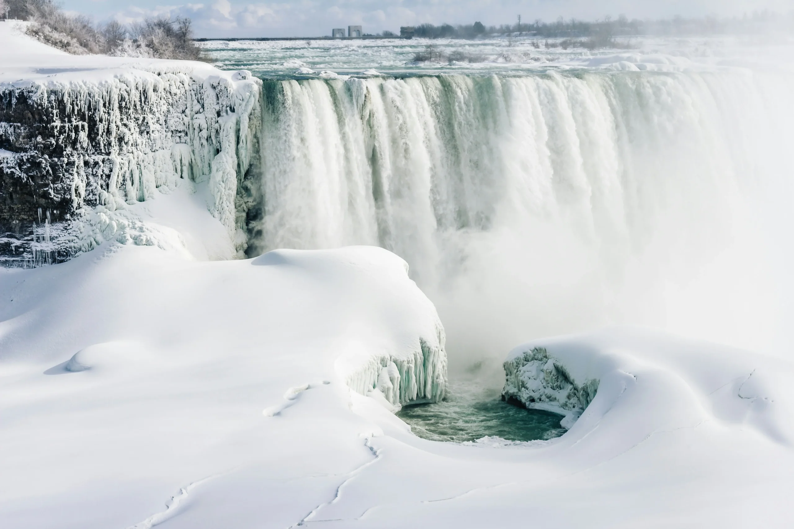 Horseshoe Falls covered in ice during winter in Niagara Falls Canada